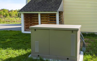 A Home Backup Generator Installed On A Concrete Pad Outside A Home.